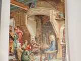 an open book with a picture of a group of people sitting in a room