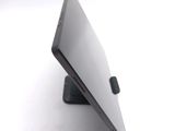 a close up of a laptop on a stand on a white surface