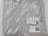 the shirt is in a plastic bag with a tag on it