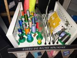 many spools of thread in a box on a table