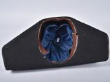 an image of a black hat with a blue cloth inside of it