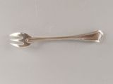 silver spoon and fork on a white surface