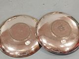 pair of antique silver plated dishes on a table top
