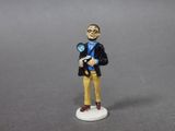 a figurine of a man holding a camera