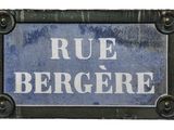 a sign that says rue bergerre on the side of a building