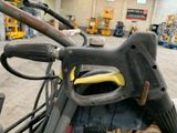 a close up view of a forklift in a warehouse