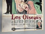 poster for the movie les oiseaux, starring marilyn monroe and her husband