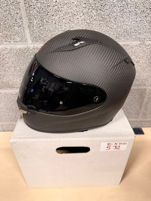 a helmet sitting on top of a box on a table