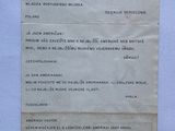 an old letter from a man who is holding up a piece of paper