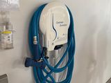 an electric charger attached to a wall in a garage