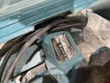 a blue tool that is sitting in a blue box