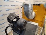 a blower sitting on top of a table next to a wall