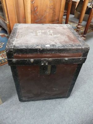 a trunk that is sitting on the floor in a room