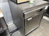 a microwave sitting on top of a stainless steel cabinet