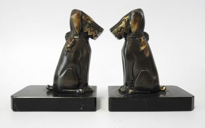 pair of bronze dog bookends on black marble bases