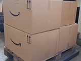 two boxes on a pallet that are stacked on top of each other