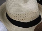 many hats that are sitting on a table together