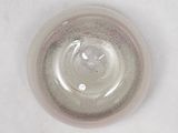 a close up of a glass of water on a white surface
