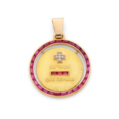 un pendentif en or 18 carats et rubis, orné d'un petit diamant