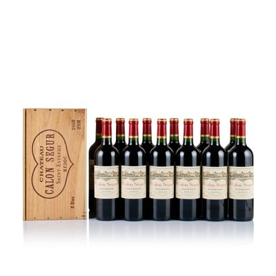 a group of six bottles of wine in a wooden box