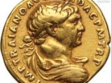 a gold coin with a woman ' s head on it