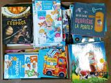 many children ' s books in a box on the floor