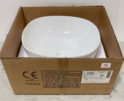 une boîte contenant un bol blanc