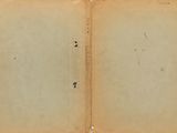 an old open book with a blank page on top of it