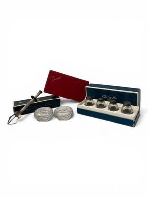 a close up of a box of chocolates with a pair of scissors