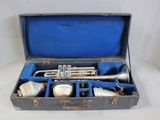 a case with a trumpet in it on a white surface