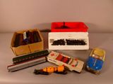 many different toy trains and cars on the table