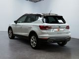 a picture of a white car parked in a garage