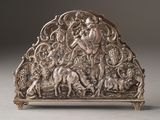 an image of a silver sculpture of a woman and a horse