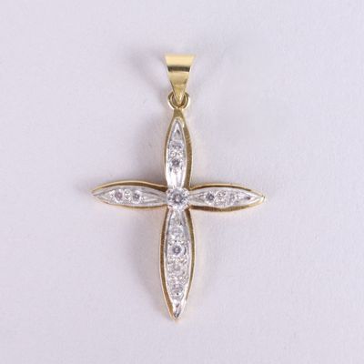 a yellow gold cross pendant with diamonds on a white background