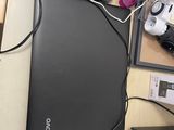 a laptop computer sitting on top of a desk next to a mouse