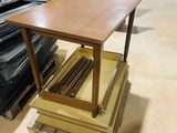 a table that is sitting on a pallet in a warehouse
