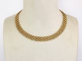 a close up of a mannequin necklace on a mannequin mannequin