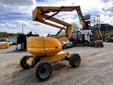 a yellow crane that is sitting in a parking lot