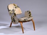 a chair that has a pattern on the back of it