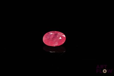 a pink diamond on a black background