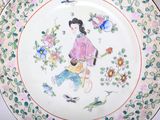 a plate with a picture of a woman on it