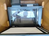 someone is taking a picture of a printer in a box