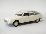 a white toy car that is sitting on a white surface