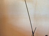 a lamp that is on the floor next to a wall