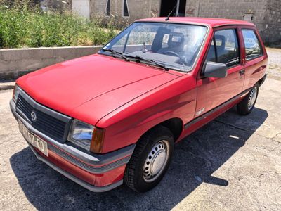 a red car that is parked in a parking lot
