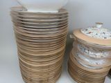 many plates stacked on top of each other with a bowl on top