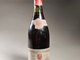 a bottle of wine that is sitting on a table