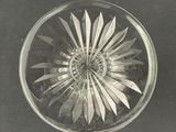 a glass bowl with a flower inside of it