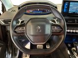 the interior of a car with a steering wheel and dashboard controls