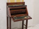 a wooden desk with a marble top on it